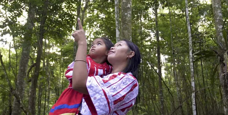 Asian woman holding child 